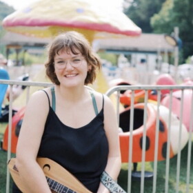 Musician poses with her dulcimer.