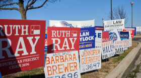 Campaign signs crowd a median along North Beach Street outside the Northpark YMCA on Feb. 23, 2026.