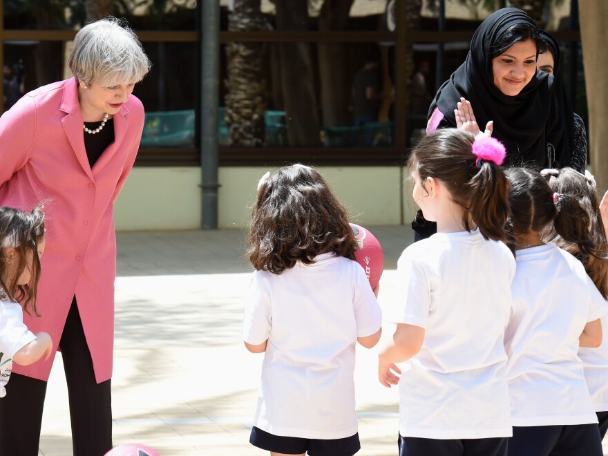 Princess Reema Bint Bandar al-Saud (right), the head of Saudi Arabia's General Sports Authority, and British Prime Minister Theresa May visit with Saudi girls during a basketball class at the Olympic headquarters in Riyadh on April 5, 2017. "When you live in a community where, overnight, what was a 'no' is a 'yes,' it's very hard to rationalize if there's no 'why,'" Bandar says.