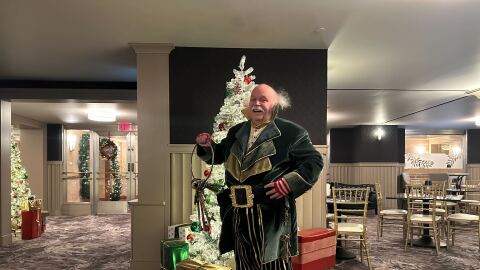 Mr. Jingeling spends the holiday season greeting people by flashing a winning smile and jingling his keys.