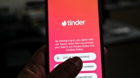 A Tinder user signs in to the app. (Aamir Qureshi/AFP via Getty Images)
