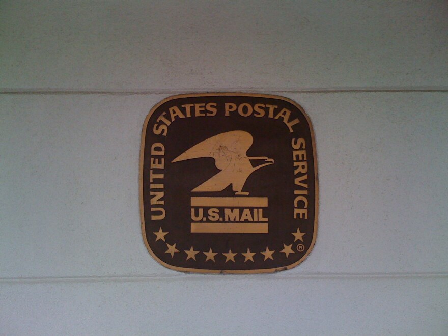 The Post Office sign on the side of the closing Whittier Station.