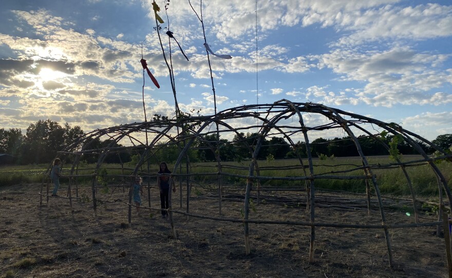 The sun begins to set behind the finished lodge.