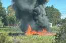 Fire burning after the military plane crash. The plane went down shortly before 2pm on Thursday.
