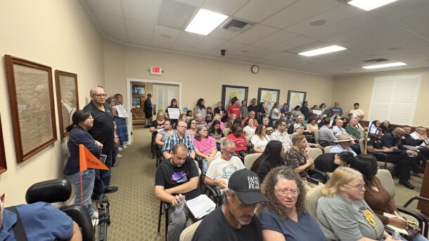 Dozens of people wait to speak against data centers before the Hanford City Council meeting begins on the evening of Tuesday, July 21, 2026.