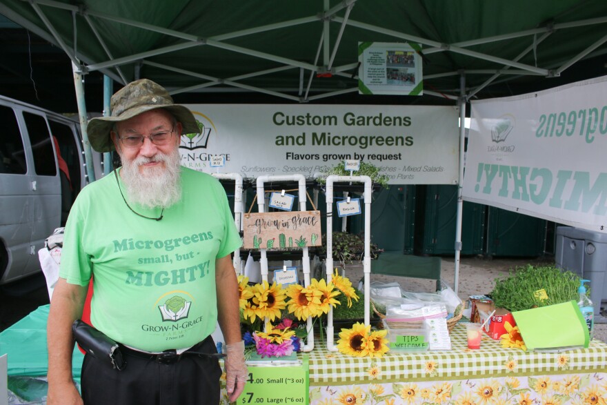 Tim Keyes and his specialty agribusiness vendors tent at Gainesville Farmers Market at Heartwood and South Main Station, September 16, 2022. (Ismara Corea/WUFT News)