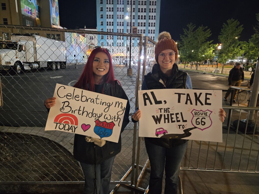 Brandie Lewis (left) and Amethyst DiTieri (right) holding their signs while in line for the Today Show's Route 66 Centennial broadcast.