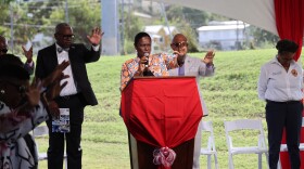 Pictured: Apostle Mona Barnes leads a formal blessing of newly commissioned ambulances for VIFEMS.