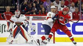 Carolina Hurricanes' Jack Drury (18) battles with Florida Panthers' Gustav Forsling (42) in front of goaltender Sergei Bobrovsky (72) during the first period of Game 2 of the NHL hockey Stanley Cup Eastern Conference finals in Raleigh, N.C., Saturday, May 20, 2023.