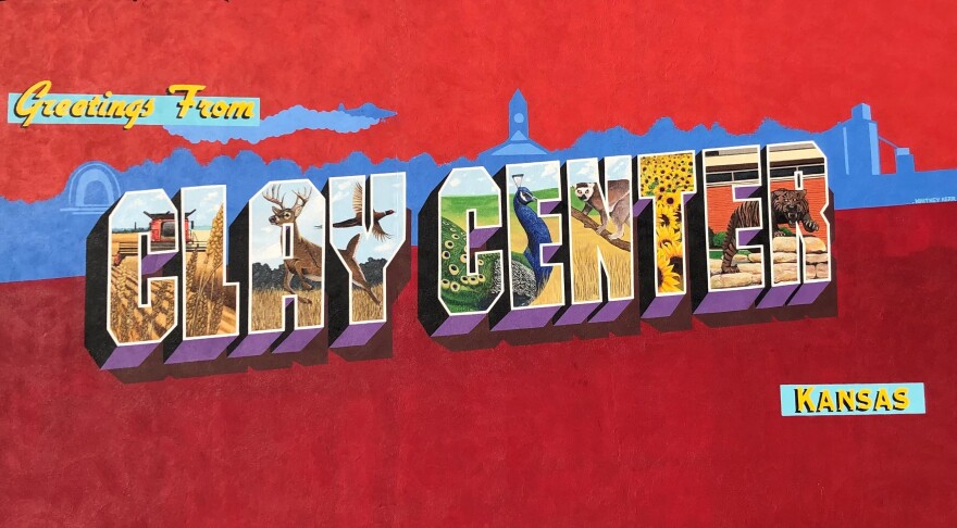 A mural that says Greetings from Clay Center, Kansas