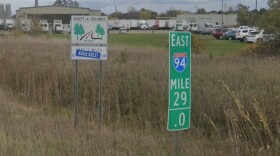 A mile marker sign stands along eastbound Interstate 94 near Benton Harbor, within the corridor where MDOT is rebuilding the highway as part of a $204 million project.