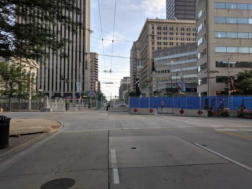Downtown streets and businesses began closing Thursday night ahead of Saturday's rally.
