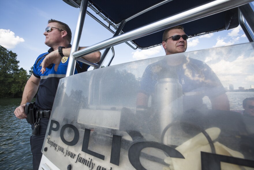  Dave Billins and Steve Scheuer with the Austin Police Department patrol the lake. 