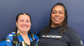 photo of two women smiling next to eachother 