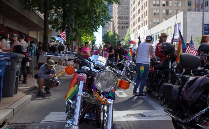 Motorcycle decked out in rainbow colors, minutes before the start of the pride parade.