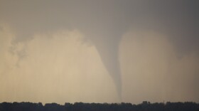A tornado forms and touches down north of Soloman, Kansas, Saturday, April 14, 2012.