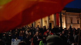 A crowd gathers outside London's National Gallery in Trafalgar Square March 13, 2014 for a vigil to mark the third anniversary of the start of Syria's civil war.