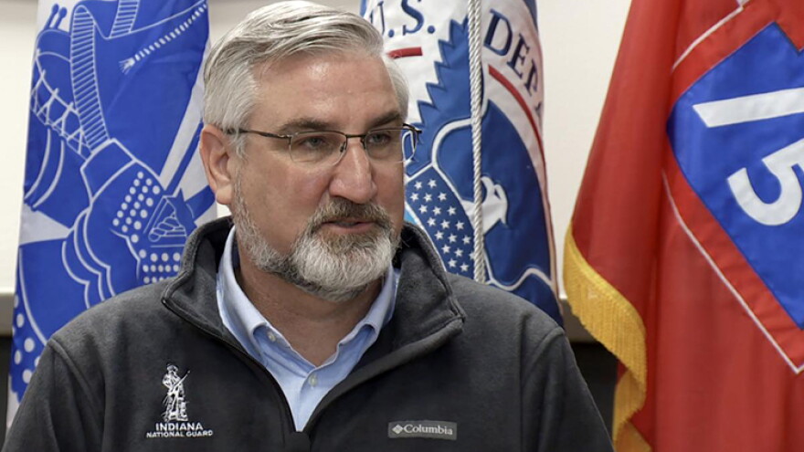 Gov. Eric Holcomb speaks during a Tuesday news conference at Camp Atterbury.