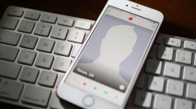 The dating app Tinder is seen on the screen of an iPhone. (Joe Raedle/Getty Images)