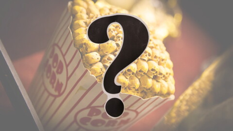 A bucket of movie popcorn, but the popcorn is skulls; a question mark in the foreground