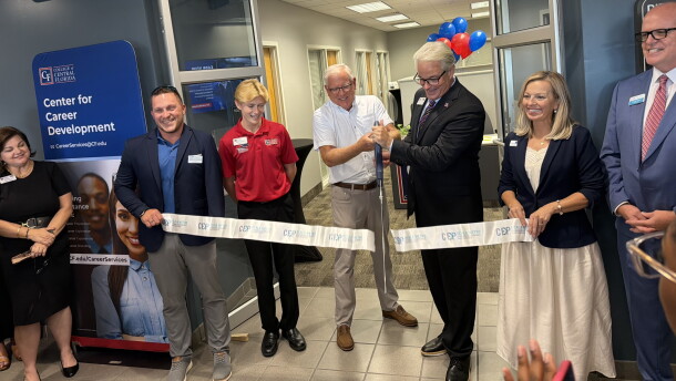 James Henningsen (third from right)President of the College of Central Florida and 2025-2026 Board of Trustees member Rusty Branson cutting the ribbon, officially opening the new Center for Career Development at the CF Ocala Campus Enterprise Center. (Jake Hoffman/WUFT News)