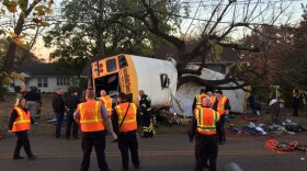 Rescuers work on the scene of a school bus crash in November 2016 in Chattanooga, Tenn. School bus driver Johnthony Walker was convicted Thursday of negligent homicide and other charges in the crash, which killed six children.