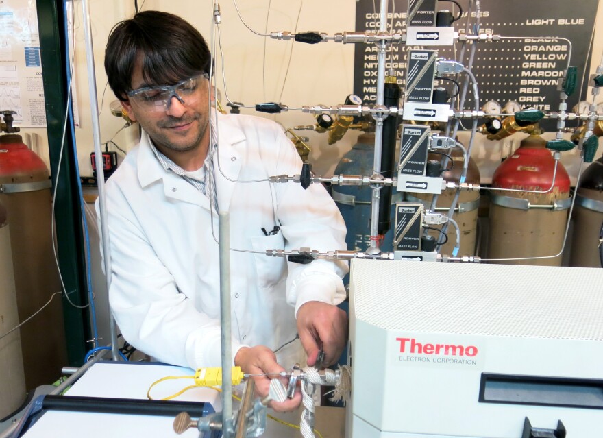 Anthony Richard, a chemical engineering student at the University of Wyoming, experiments with converting CO2 into methanol.