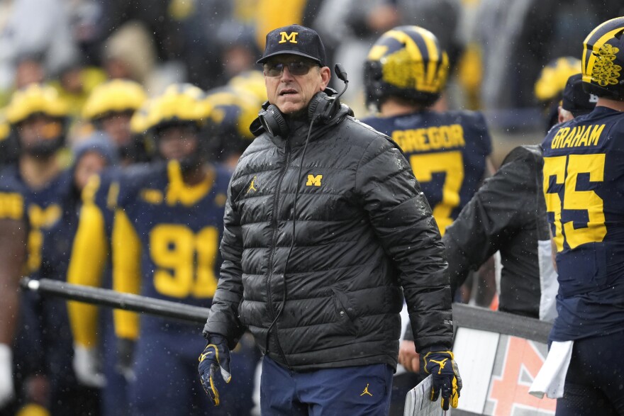 Michigan suspends football program employee while under NCAA investigation