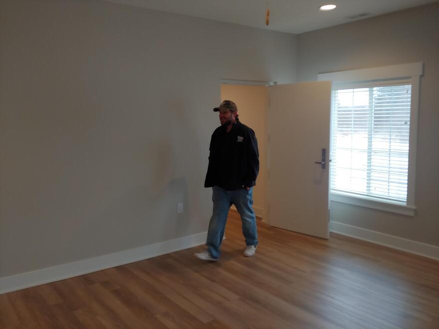 Bobby McCardle walks into one of the rooms of his new home.