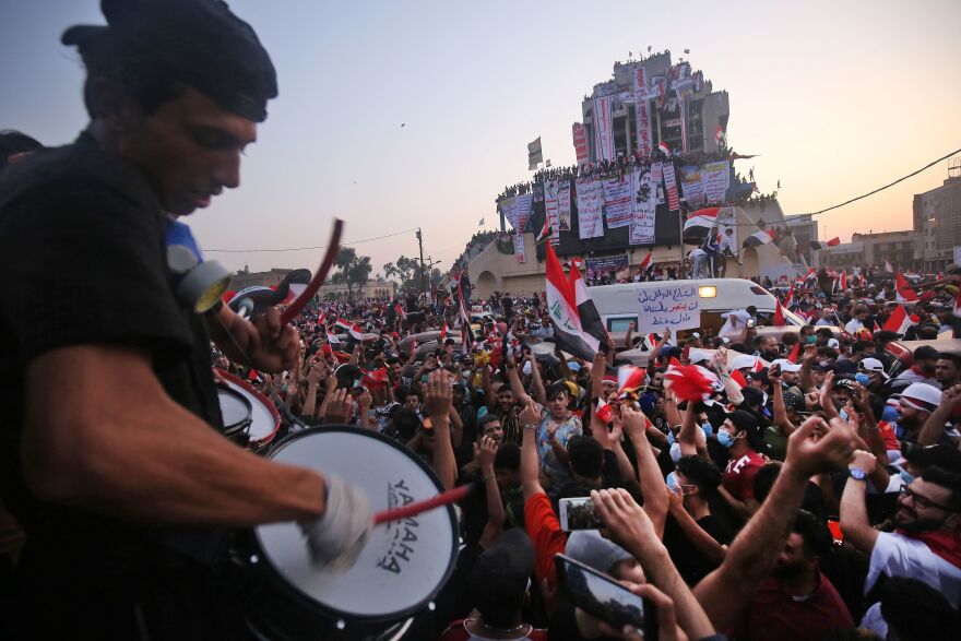 Iraqi protesters gather for anti-government demonstrations Wednesday in Baghdad. Rallies in the capital and across the south have swelled in recent days, defying curfews, threats of arrest and violence from security forces.