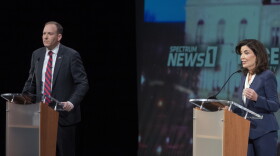 Republican candidate for New York governor U.S. Rep. Lee Zeldin, left, participates in a debate against incumbent Democratic Gov. Kathy Hochul hosted by Spectrum News NY1 and WNYC, Tuesday, Oct. 25, 2022, at Pace University in New York. (AP Photo/Mary Altaffer, Pool)