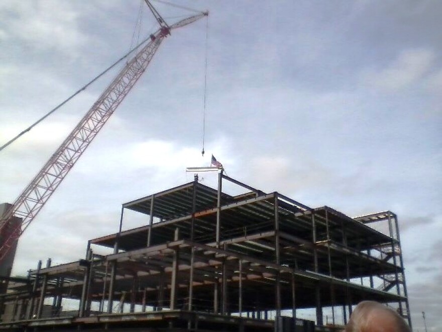 Final steel beam added to ECMC building