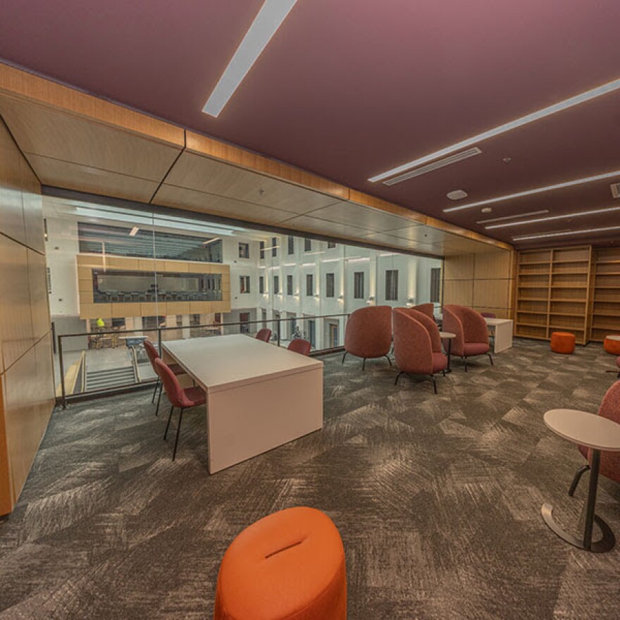 A rendering of the interior of Miami University's Bachelor Hall showing a classroom with a window's view to the building's common area.