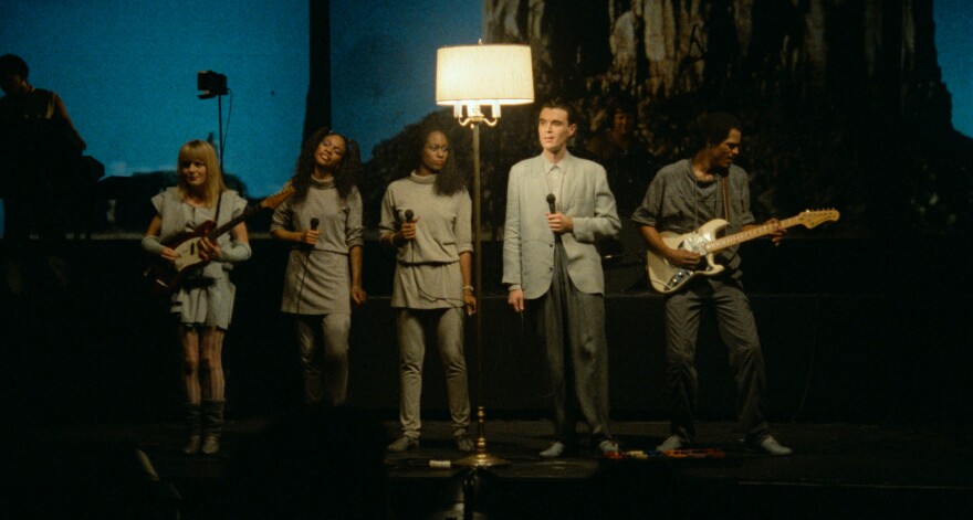 Talking Heads onstage with their backing musicians in "Stop Making Sense."