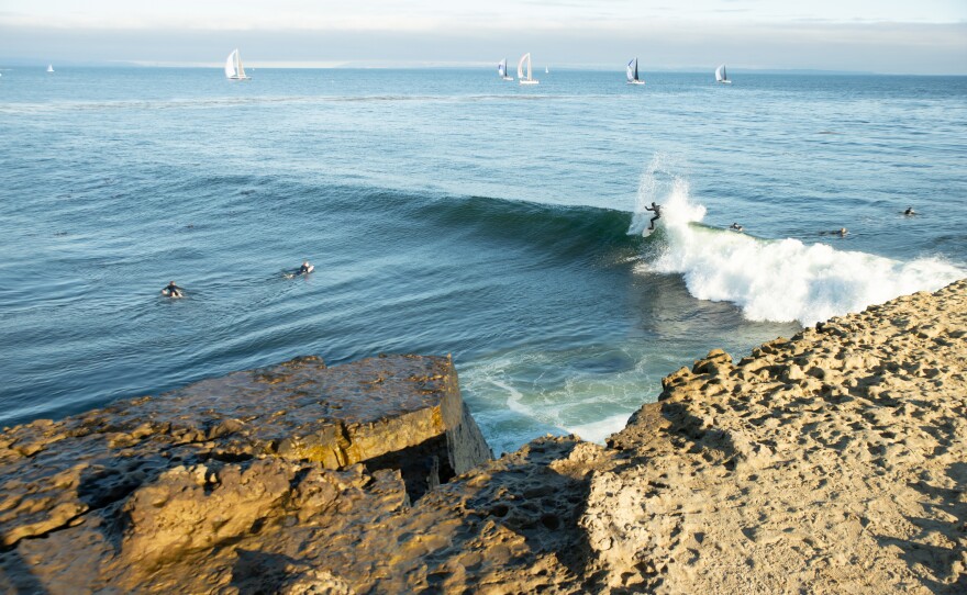 A surfer rides a wave at Steamer Lane, one of the spots that surfers say erosion is changing.