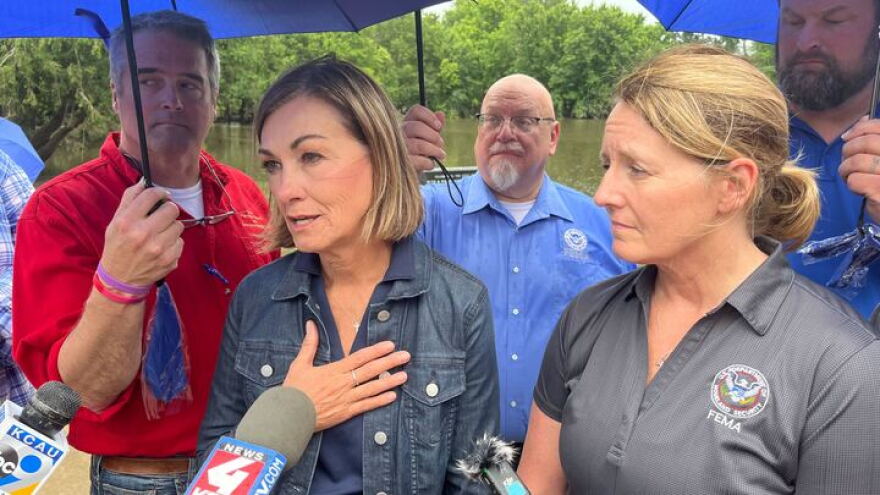 Gov. Kim Reynolds speaks to media alongside FEMA Administrator Deanne Criswell.