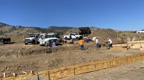  A construction crew works on the foundation of a custom home in the wildland-urban interface in Reno, Nev., on Oct. 12, 2022.