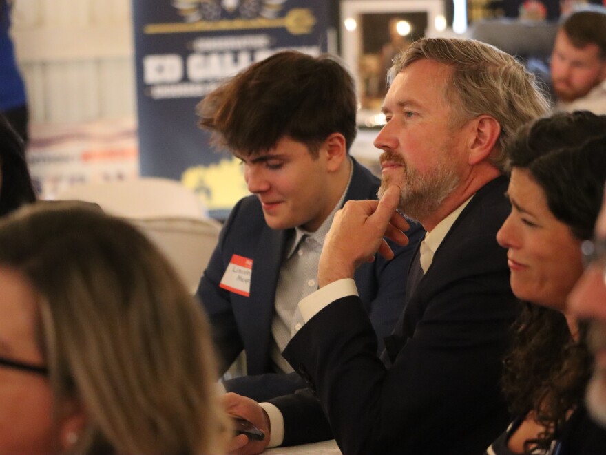 U.S. House Rep. Thomas Massie, who currently represents the northern Kentucky district, listens as his Trump-backed challenger Ed Gallrein attack his record at a GOP annual dinner in Pendleton County on Saturday.