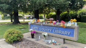 Flowers are left outside the Butte County Library in Chico, Calif. on June 25, 2026.