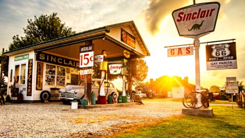 Sun rising over an old time gas station