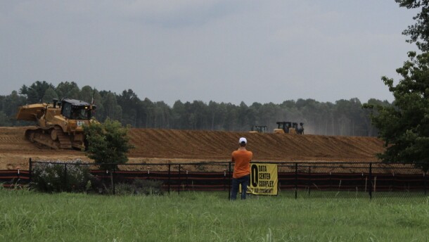 Heavy machinery clear land for a data center.