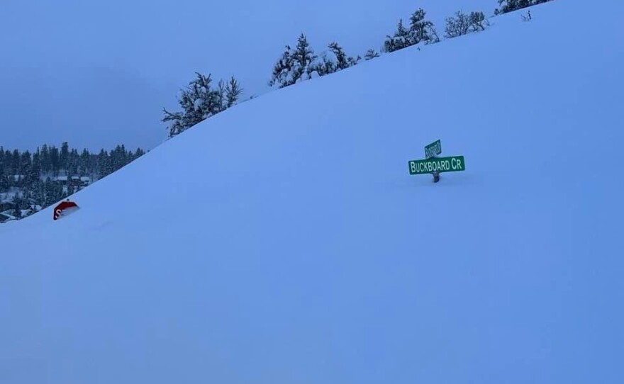 Snow covering a stop sign in Pinebrook on April 4, 2023.