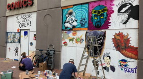 Downtown Comics invited local artists to paint the boarded up windows.