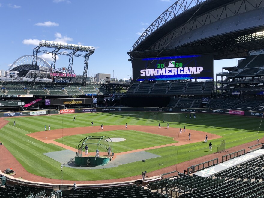 Seattle Mariners players are gearing up for the start of a shortened regular season. At their home ballpark, summer training is underway this week with strict coronavirus restrictions.