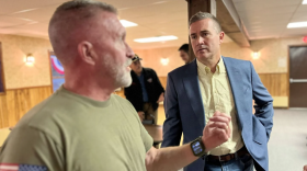 Blake Gendebien, right, speaking with Joe Fisher, an independent voter who attended Gendebien's recent event at the VFW in Saranac Lake.
