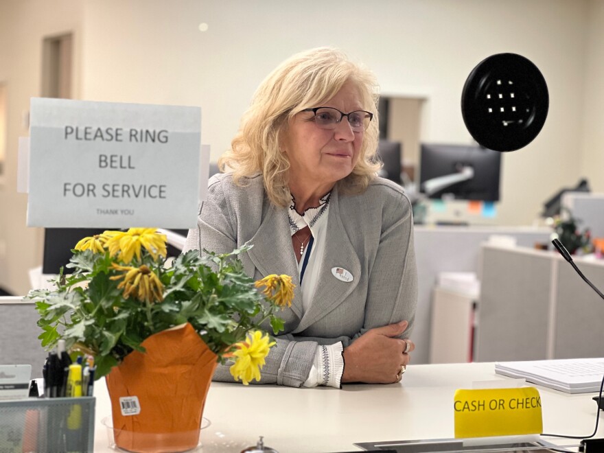 Antrim County Clerk Sheryl Guy looks through the glass at her office just before 6 a.m. the morning after the 2024 General Election (11-6-24). Guy lost her write-in bid to remain in office. Republican Victoria Bishop will take over. (Photo: Michael Livingston/IPR News)