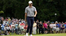 Rory McIlroy, of Northern Ireland, reacts after a shot on the 12th green during the first round of the Travelers Championship golf tournament at TPC River Highlands, Thursday, June 23, 2022, in Cromwell, Conn.