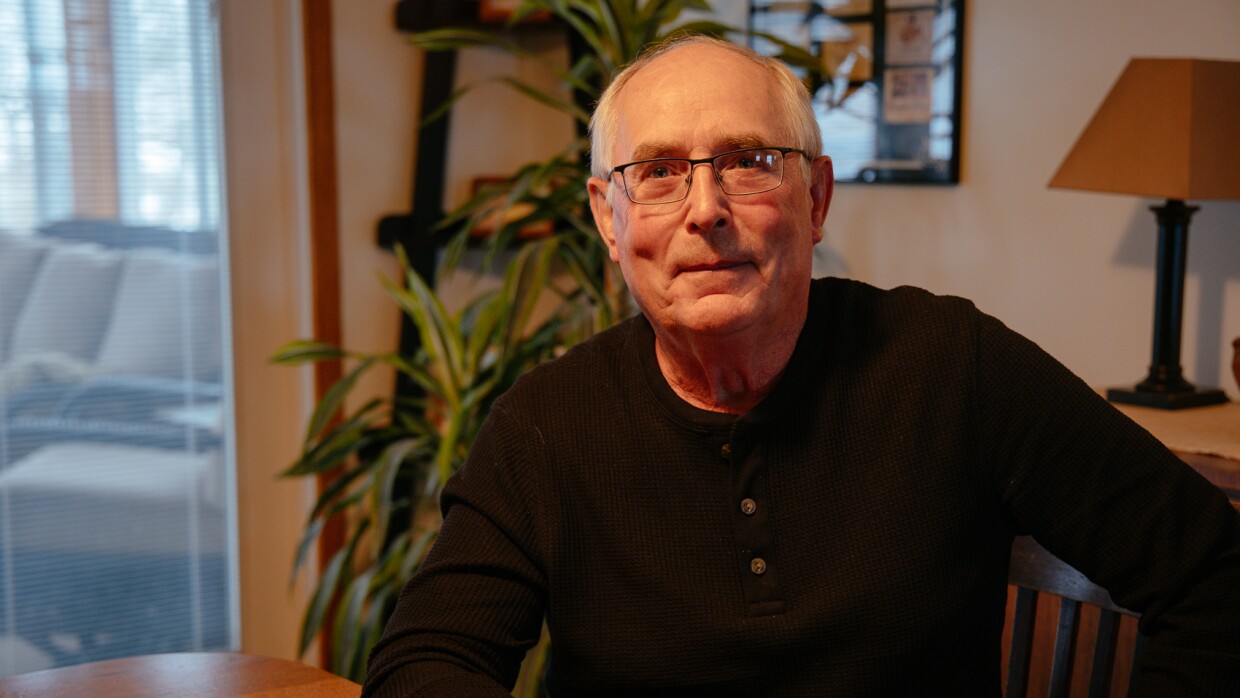 Doug Fuller sits at his dining room table in the middle of his nearly 1,000-acre corn and soybean farm.