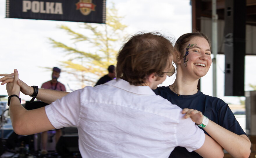Nicole Vasicek and Tobias Hynes, both of Dallas, dance to a polka song played by the Praha Brothers at the 50th anniversary of Westfest on Saturday. Vasicek grew up in West and remembers attending Westfest with her mom to dance Polka.