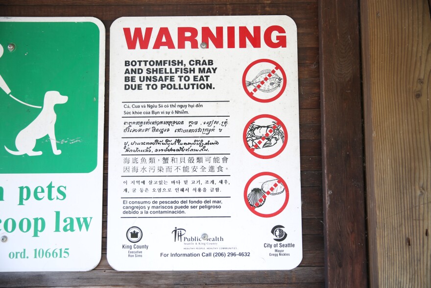 A fish advisory stands in the Duwamish Waterway Park in Seattle, across the river from the Boeing Field. Boeing, the multinational spacecraft manufacturer, is one of the major businesses alongside the river and has been one of the river’s major polluters.